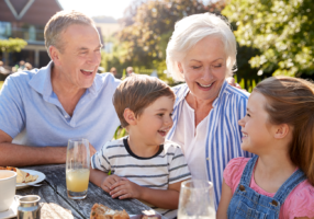 grandparents-with-grandchildren-enjoying-outdoor-XF3MYJP